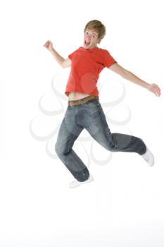 Royalty Free Photo of a Teenage Boy Jumping in the Air