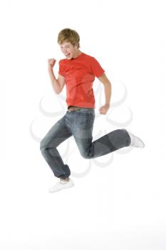 Royalty Free Photo of a Teenage Boy Jumping