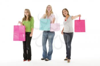 Portrait Of Teenage Girls Holding Shopping Bags