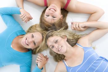 Royalty Free Photo of Teenage Girls Lying in a Circle