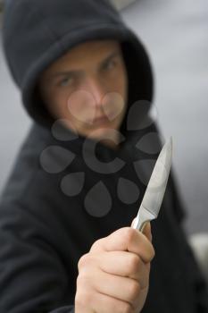 Royalty Free Photo of a Boy With a Knife