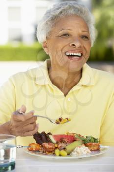 Royalty Free Photo of a Woman Eating