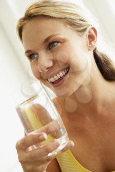 Royalty Free Photo of a Woman With a Glass of Water