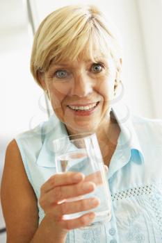 Royalty Free Photo of a Woman Drinking Water