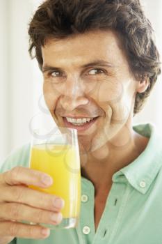 Royalty Free Photo of a Man With Juice