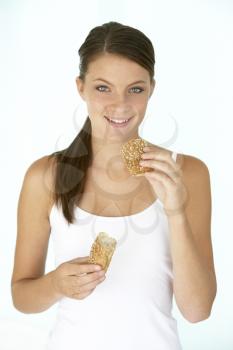 Royalty Free Photo of a Girl Eating Brown Bread