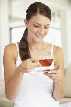 Royalty Free Photo of a Young Woman Drinking Herbal Tea