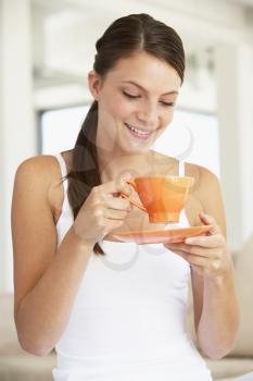 Royalty Free Photo of a Girl With an Orange Teacup