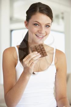 Royalty Free Photo of a Girl Eating Chocolate