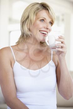 Royalty Free Photo of a Woman Drinking a Glass of Milk