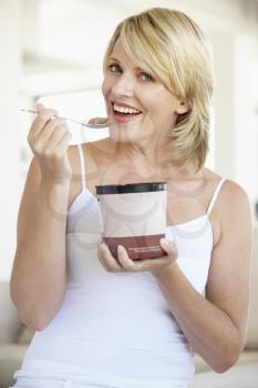 Royalty Free Photo of a Woman Eating Chocolate Ice Cream