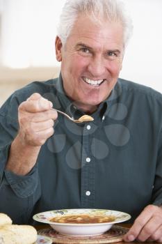 Royalty Free Photo of a Man Eating Soup
