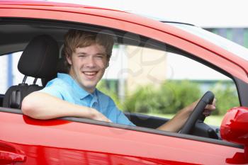 Royalty Free Photo of a Boy in a Car