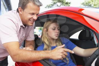 Royalty Free Photo of a Girl Learning How to Drive