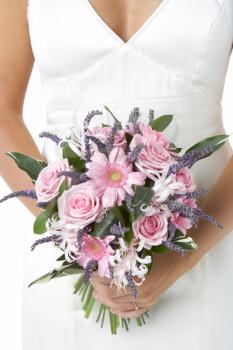 Royalty Free Photo of a Bride Holding Her Bouquet