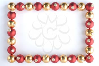 Border Made From Red And Gold Baubles Against White Background