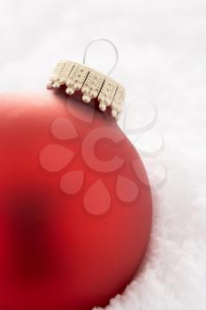 Royalty Free Photo of a Christmas Ornament in Snow