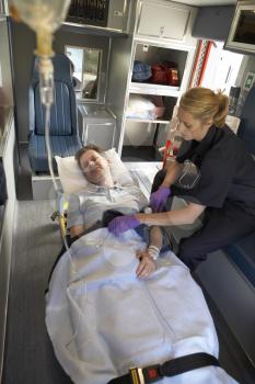 Royalty Free Photo of a Paramedic With a Patient