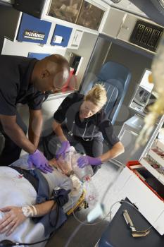 Royalty Free Photo of Paramedics Saving a Patient