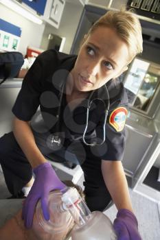 Royalty Free Photo of a Paramedic With an Oxygen Mask