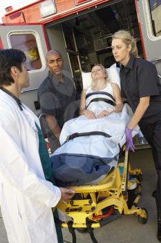 Royalty Free Photo of Paramedics and a Doctor With a Patient