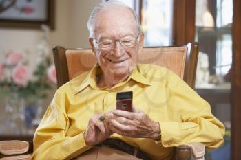 Royalty Free Photo of a Man Sending a Text Message