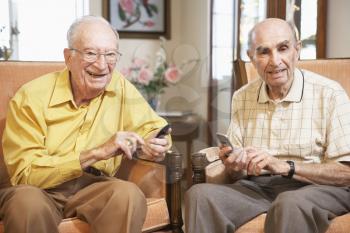 Royalty Free Photo of Two Men Texting