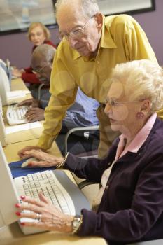 Royalty Free Photo of a Senior Couple at a Computer