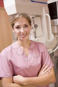 Royalty Free Photo of a Nurse With a Mammogram Machine