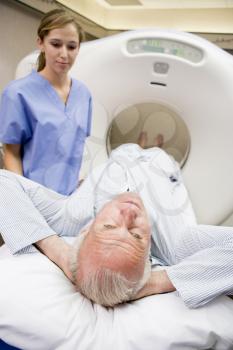 Royalty Free Photo of a Nurse With a Man About to Have a CAT Scan