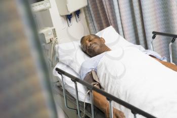 Royalty Free Photo of a Patient in a Hospital Bed
