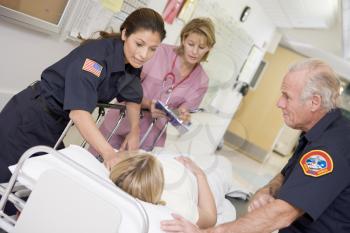Royalty Free Photo of Paramedics and a Nurse With a Patient