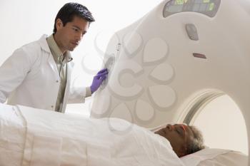Royalty Free Photo of a Doctor With a Patient Having a Scan