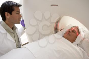 Royalty Free Photo of a Doctor With a Patient Having a Scan