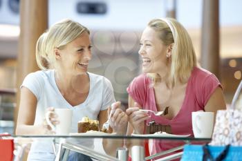Royalty Free Photo of Two Women Eating at a Mall