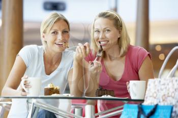Royalty Free Photo of Two Women Having Lunch at a Mall