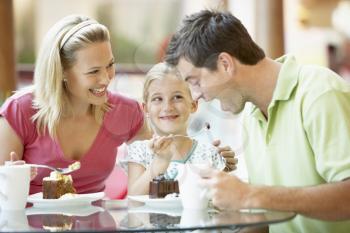 Royalty Free Photo of a Family Having Cake at a Mall