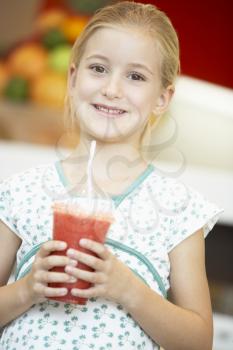 Royalty Free Photo of a Girl With a Berry Smoothie