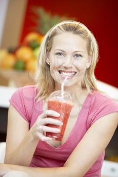 Royalty Free Photo of a Woman With a Berry Smoothie
