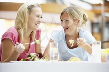 Royalty Free Photo of Two Women Having Lunch at a Mall