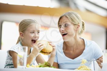 Royalty Free Photo of a Mother and Daughter Having Lunch at a Mall