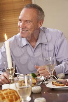 Royalty Free Photo of a Man at a Dinner Party
