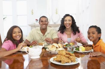 Royalty Free Photo of a Family Eating a Meal at Home