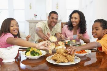 Royalty Free Photo of a Family Eating a Meal