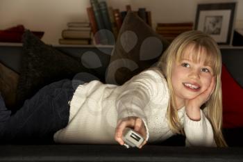 Royalty Free Photo of a Little Girl Watching Television