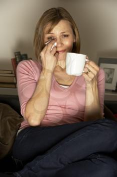 Royalty Free Photo of a Woman Crying and Drinking Coffee