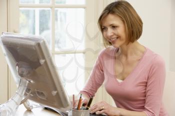 Royalty Free Photo of a Woman Using a Computer