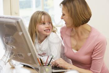 Royalty Free Photo of a Mother and Daughter at the Computer