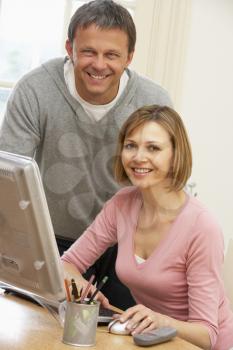 Royalty Free Photo of a Couple Using a Computer