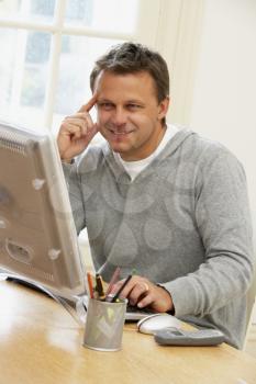 Royalty Free Photo of a Man Using a Computer